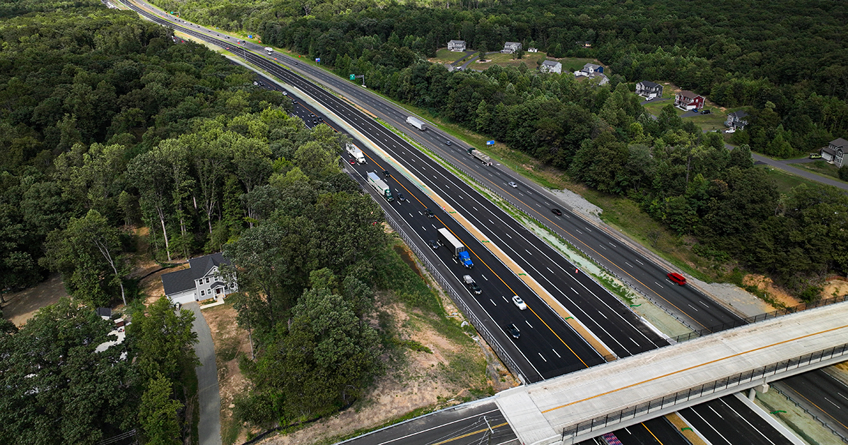 Aerial view of highway set amongst trees
